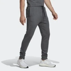 ADIDAS Essentials Fleece Regular Tapered Men's Pants -Columbia Store Essentials Fleece Regular Tapered Pants Grey HL2243 25 model